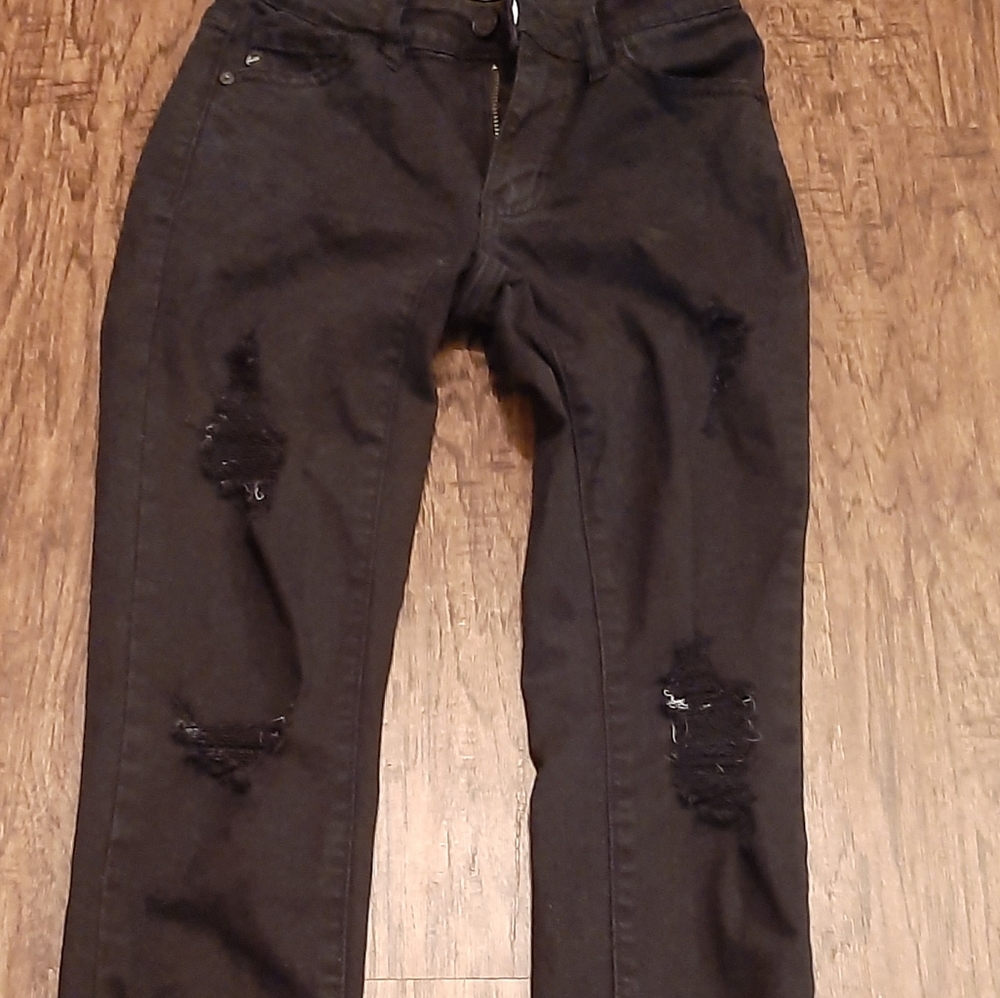 Distressed black skinny Jeans.